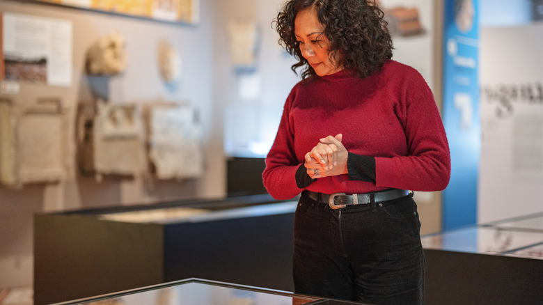 woman looking at base cabinet