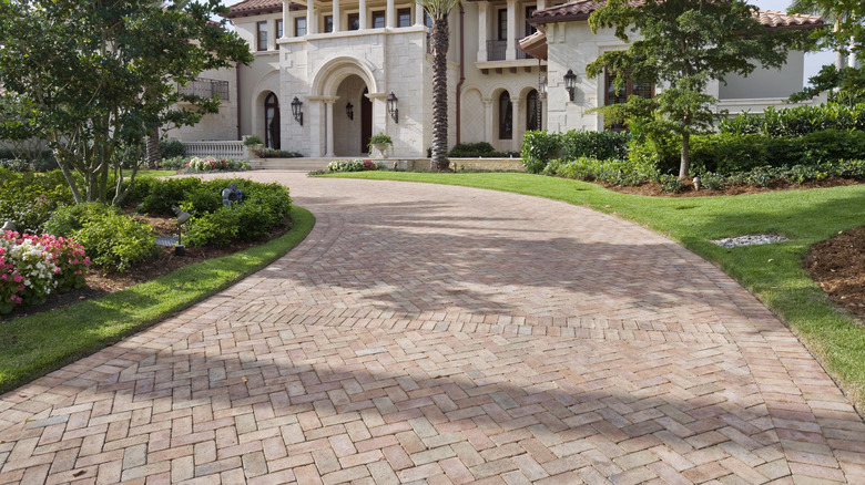 Paver driveway alongside house