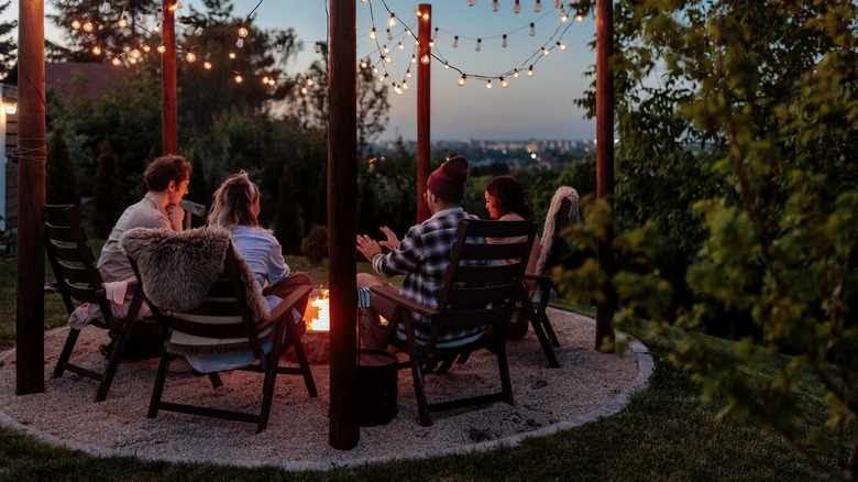 people seated by fire pit