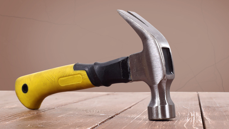 curved claw hammer with yellow grip