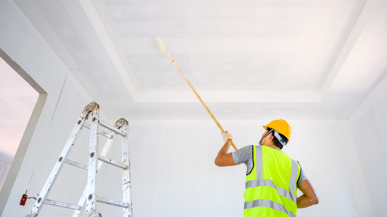 contractor painting a ceiling 