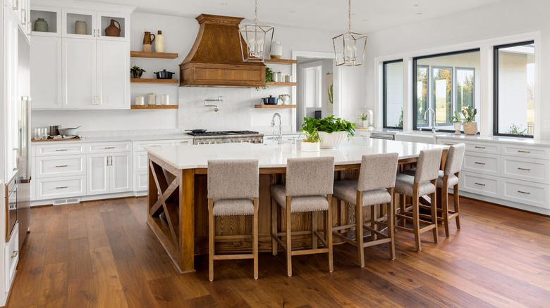 dark floors and white cabinets kitchen