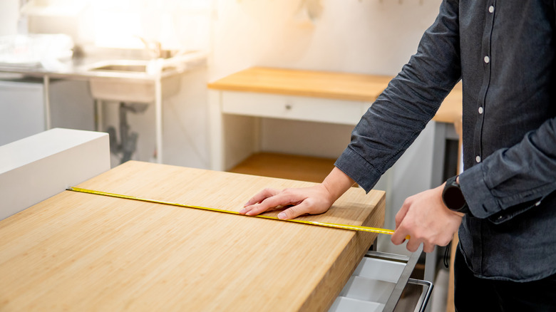 Man installing a wooden countertop