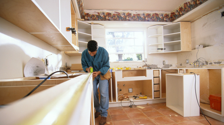 Contractor working in kitchen