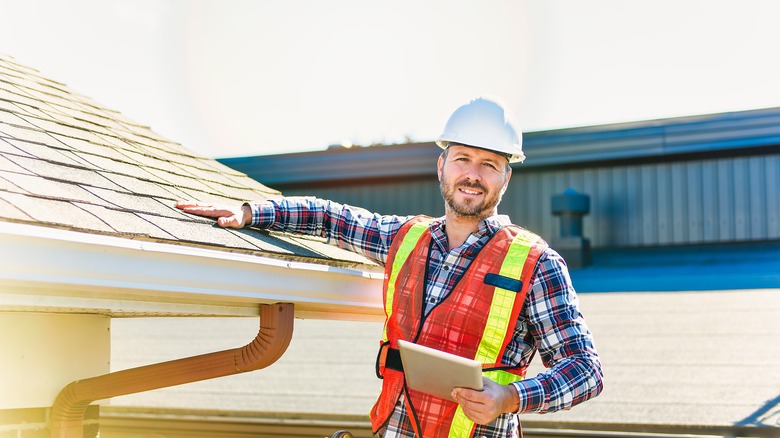 Man inspecting roof