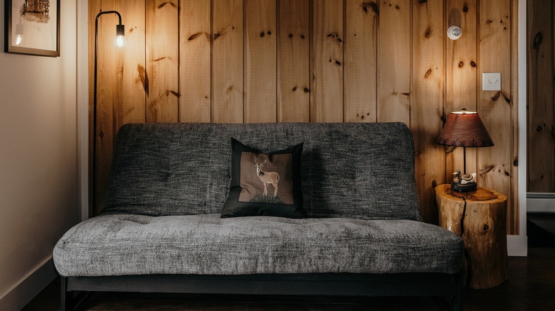 Metal futon in rustic room