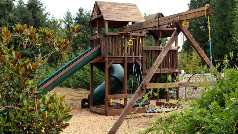Playset surrounded by wood chips 
