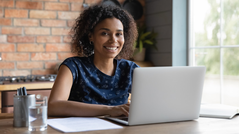 Woman pressing computer