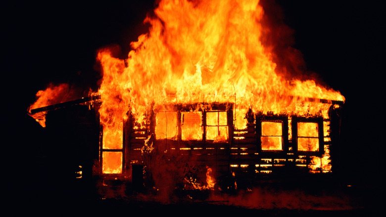 House in flames at night