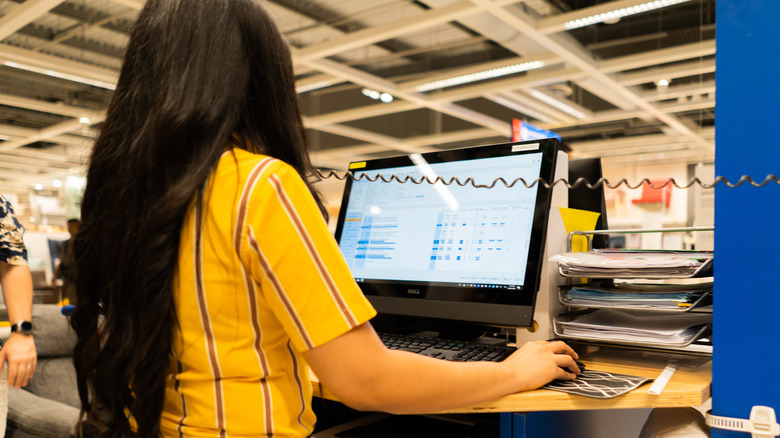 IKEA employee on computer