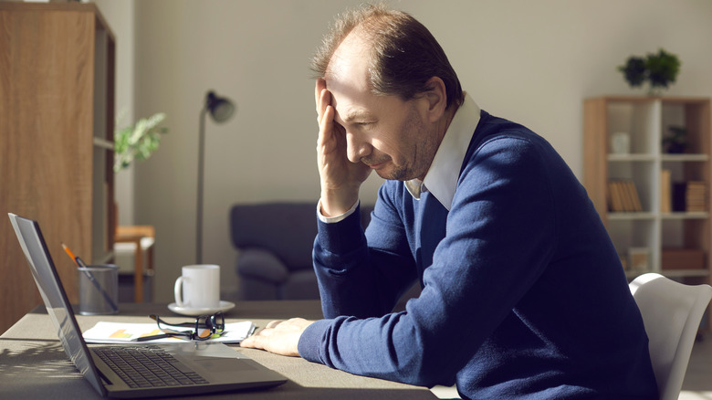 man staring at his computer