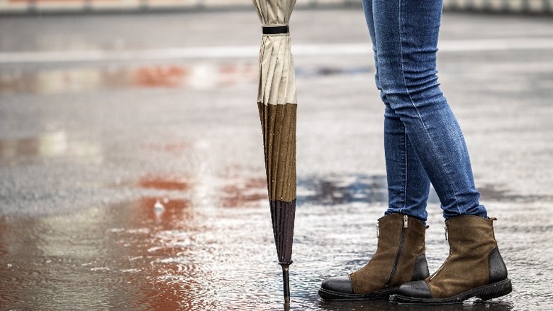 Woman wearing boots in rain