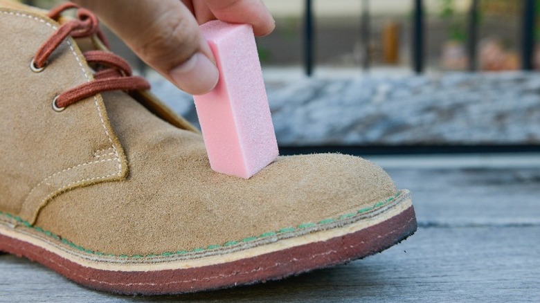 Cleaning boot with suede eraser
