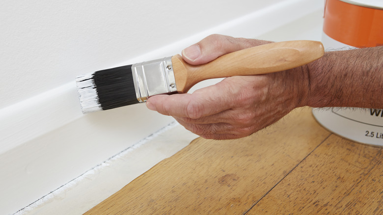 Close up of painting skirting board