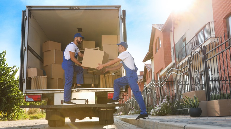 two men moving boxes