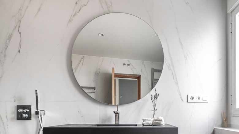 Frameless, circular bathroom mirror