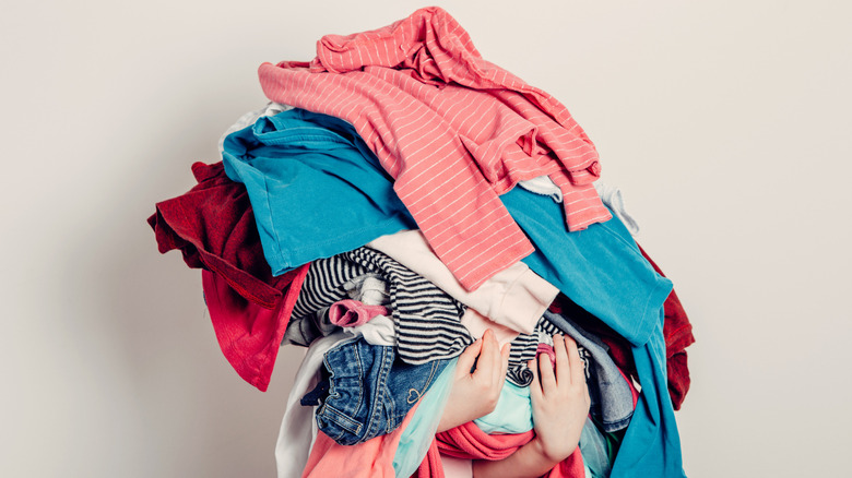 Person holding dirty laundry