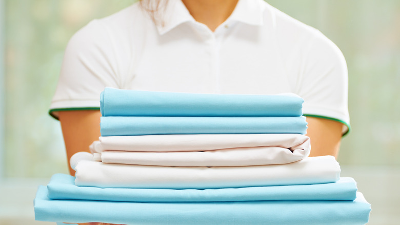 Person holding clean laundry