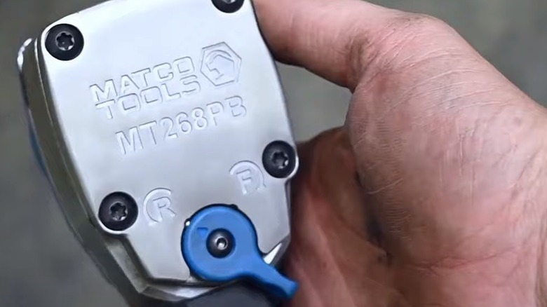 person holding Matco tool