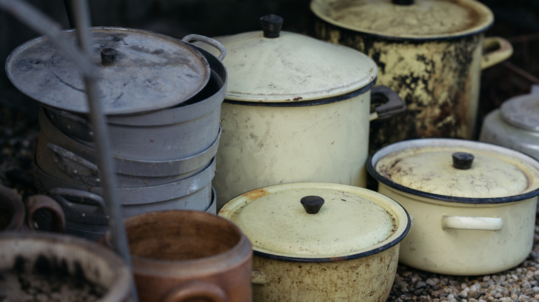 Dirty vintage pots at a flea market