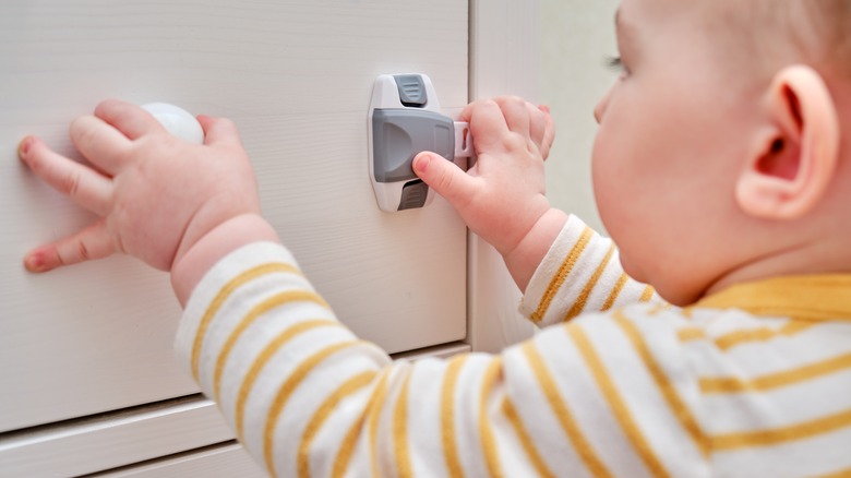 toddler trying to open door