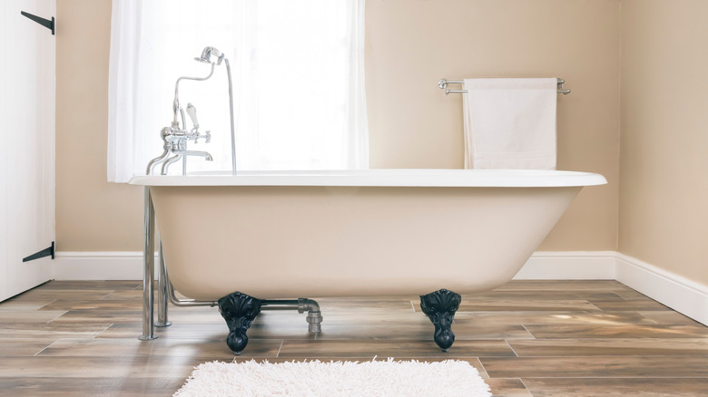 white clawfoot tub in bathroom