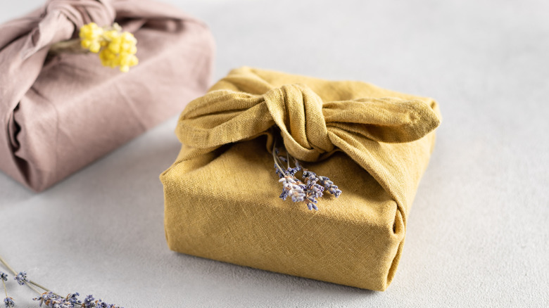 cloth wrapped gifts with flowers