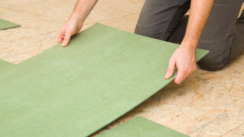 worker preparing the subfloor