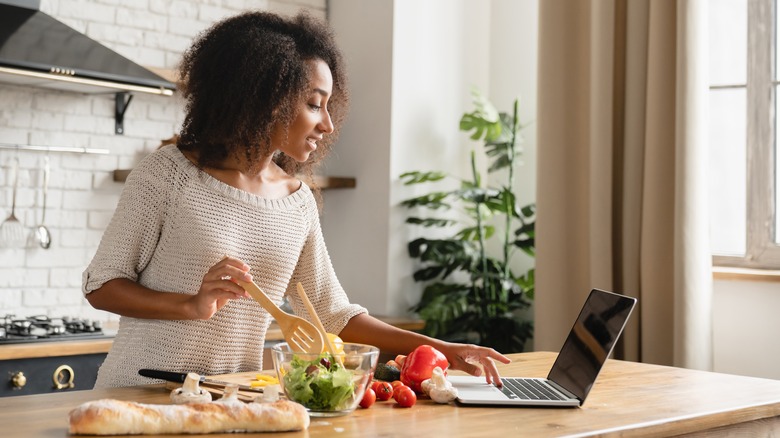 Woman cooking in beautiful kitchen