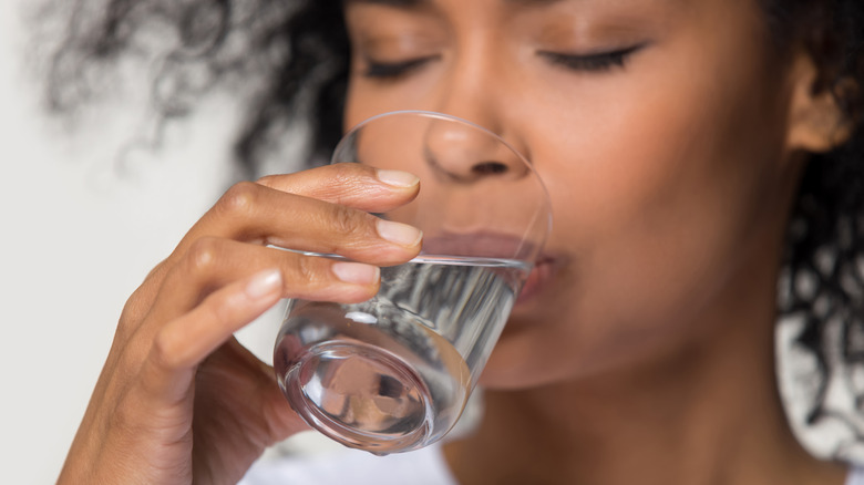 woman drinking glass of water