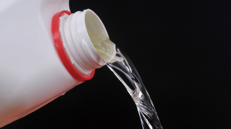 plastic bottle pouring bleach