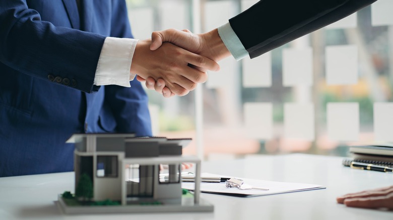 Realtor and homebuyer shaking hands