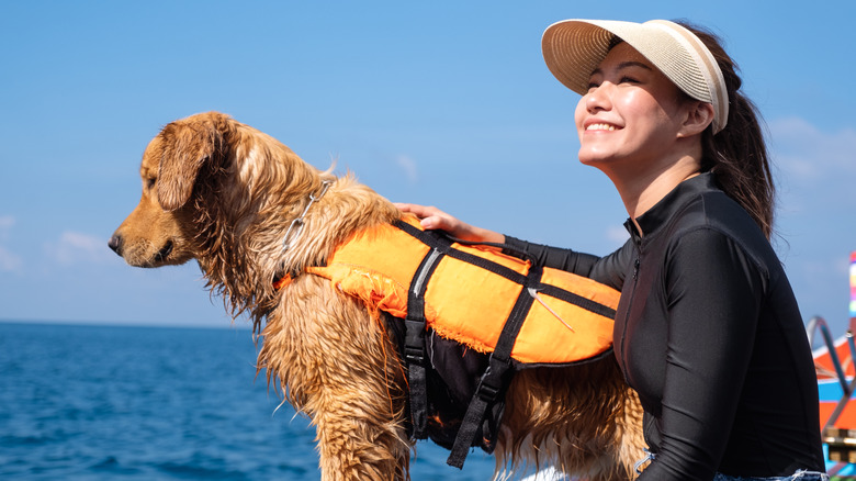 woman with dog on water