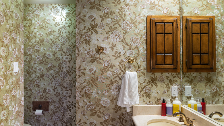 bathroom with floral wallpaper