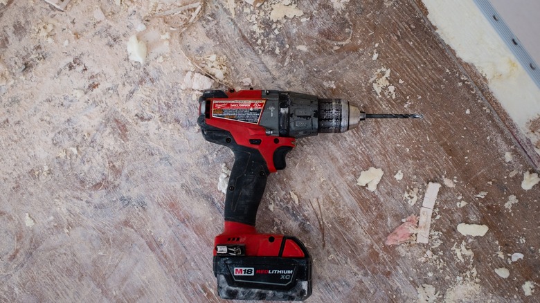 Red impact driver on floor