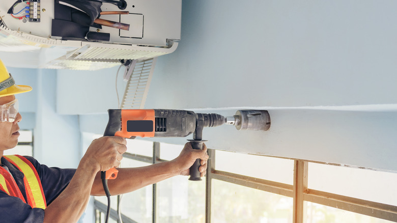 Man holding large impact driver