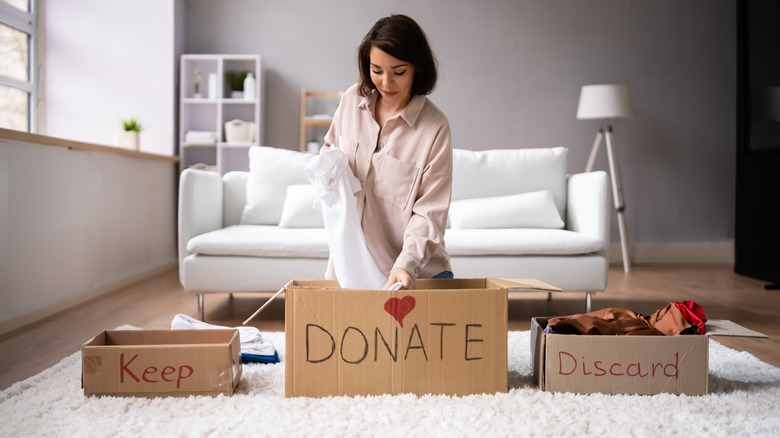 woman organizing using labeled boxes