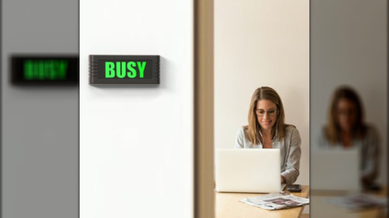 woman using BusyBox sign