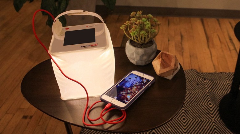 LuminAid lantern charging phone