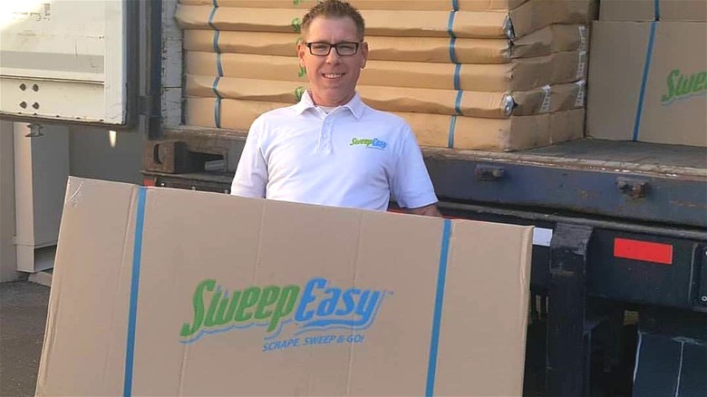 Shane Pannell with SweepEasy boxes