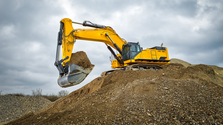 Excavator digging dirt