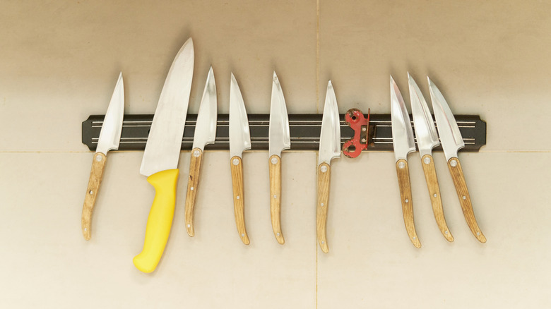 Set of knives on a magnetic wall strip