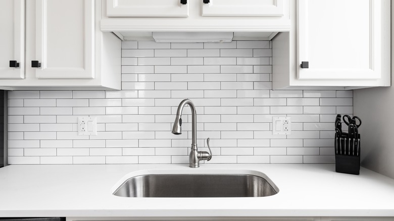 kitchen sink with granite countertop