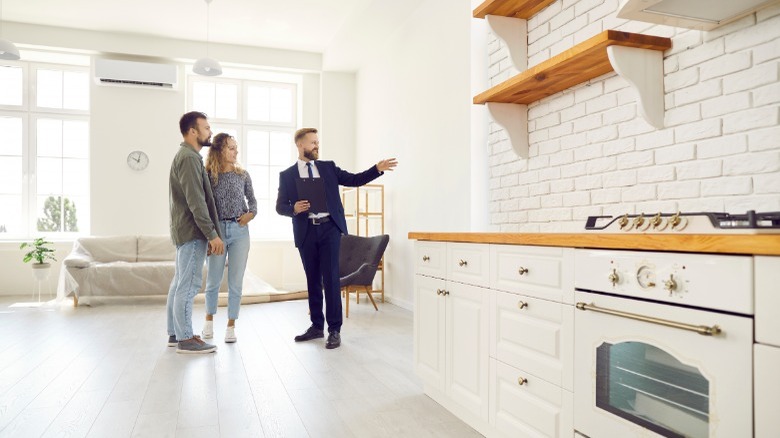 Realtor showing house with tile