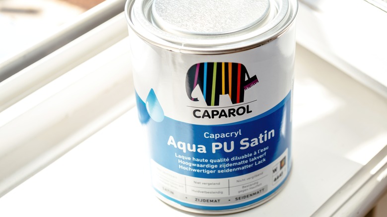 Can of satin paint on window sill