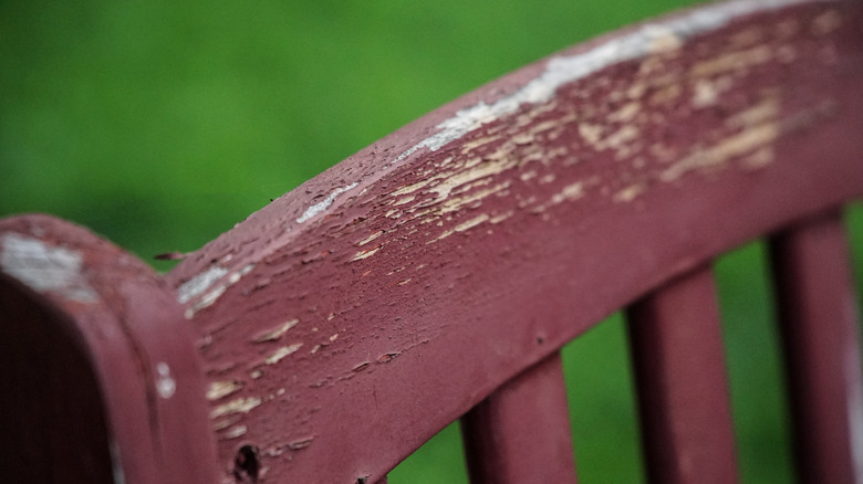 Weathered chair with red paint