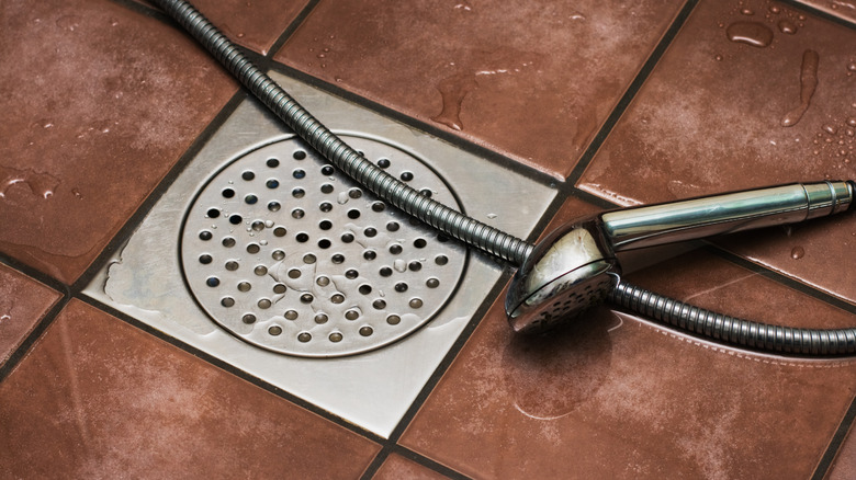 Water sitting on tile shower floor