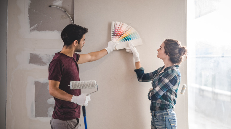 Couple looking at paint samples