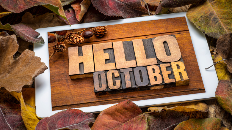 Hello October sign with leaves