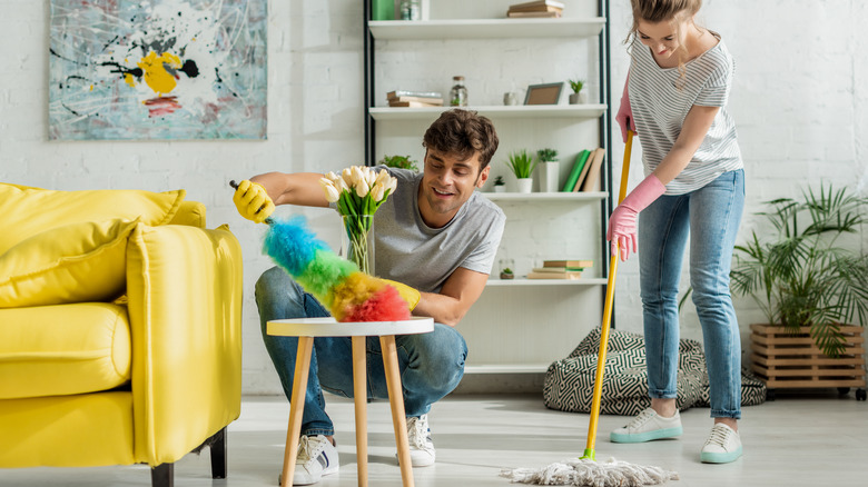 couple cleaning home